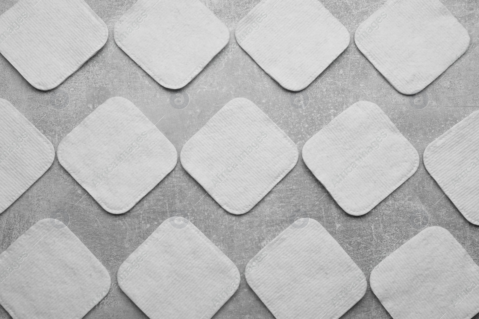 Photo of Many clean cotton pads on light grey background, flat lay