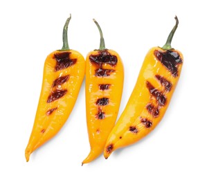 Photo of Tasty grilled yellow peppers isolated on white, top view