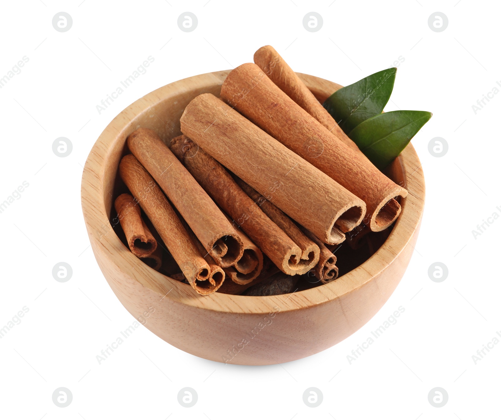 Photo of Cinnamon sticks and green leaves in bowl isolated on white