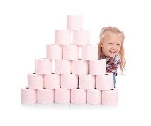 Cute little girl hiding behind toilet paper pyramid on white background