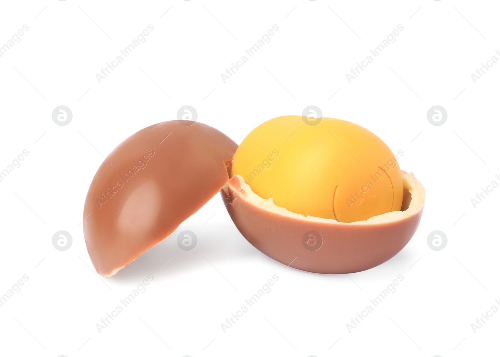 Photo of Slynchev Bryag, Bulgaria - May 23, 2023: Halves of Kinder Surprise Egg and plastic capsule with toy on white background