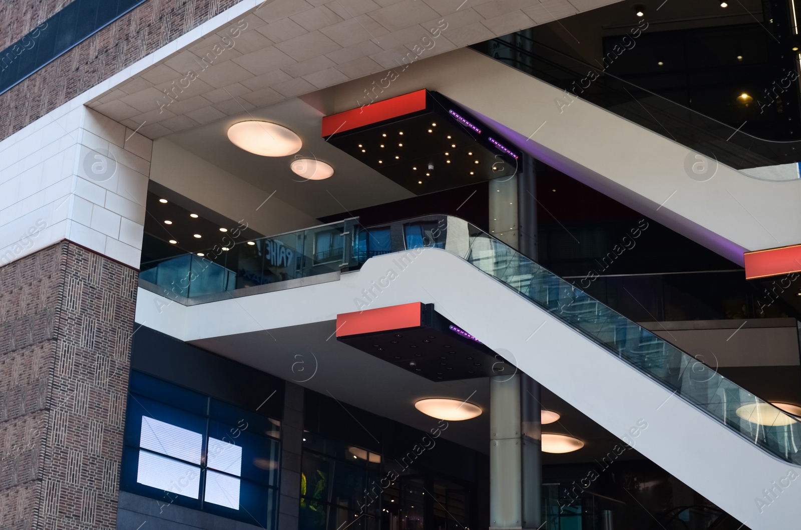 Photo of Modern escalators with handrails in shopping mall