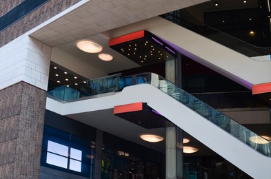 Photo of Modern escalators with handrails in shopping mall