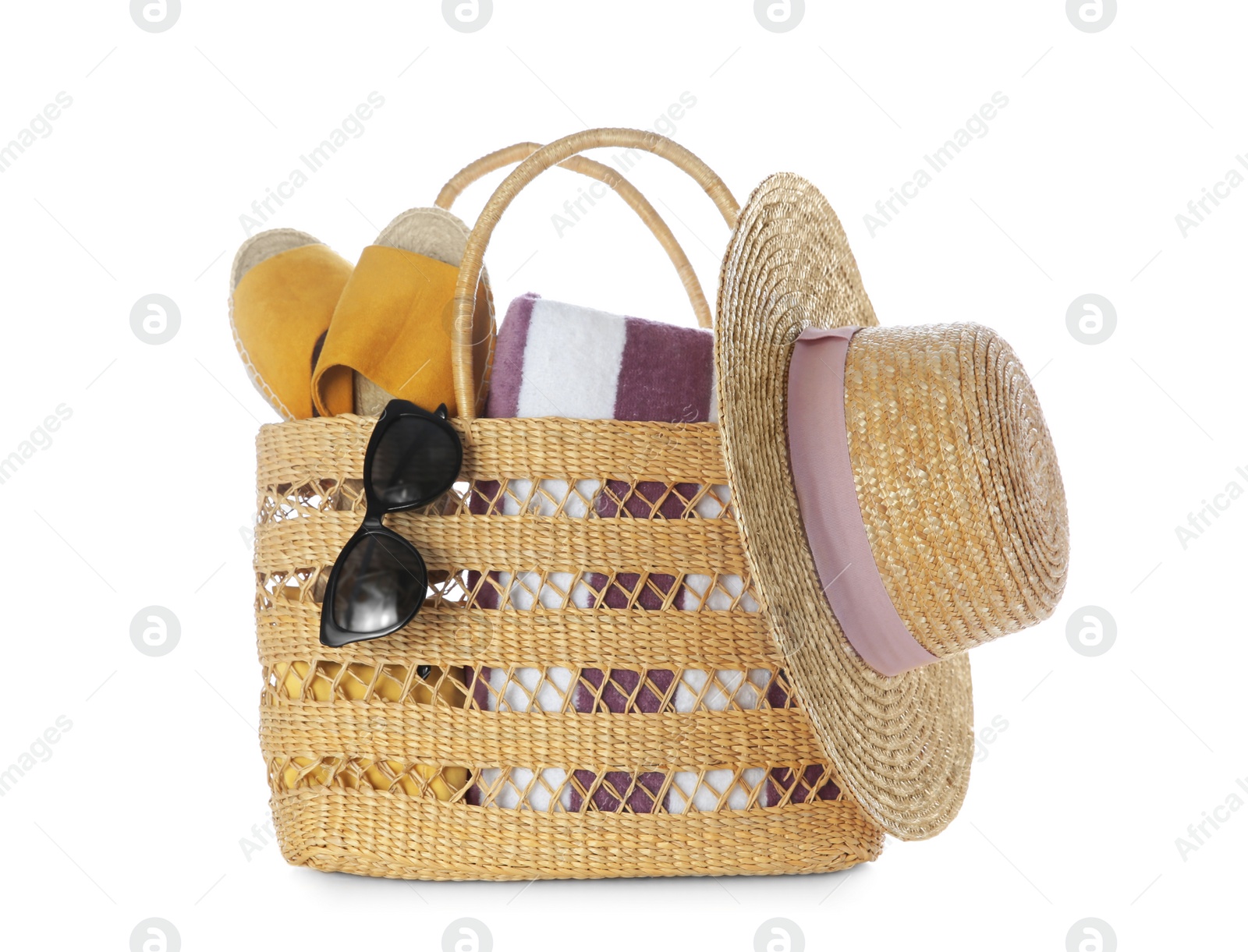 Photo of Bag with beach accessories on white background