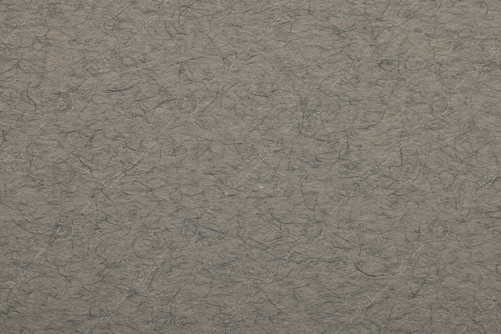 Photo of Texture of grey paper sheet as background, top view