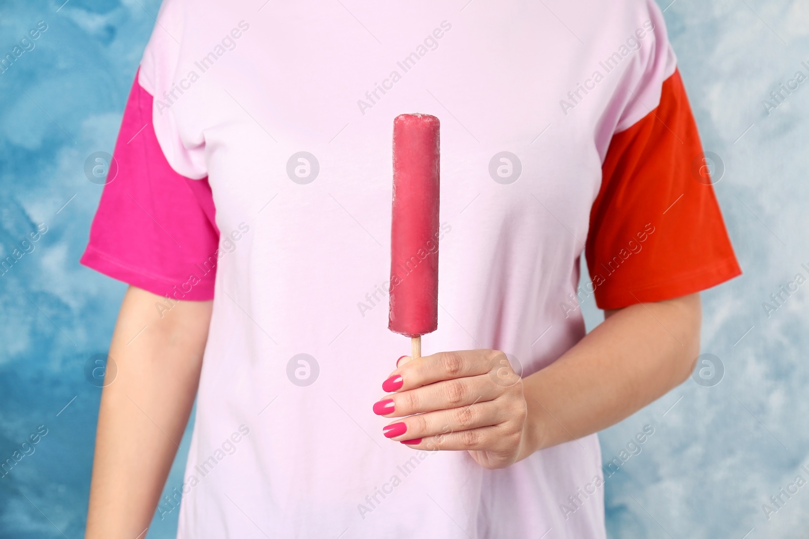 Photo of Woman holding yummy ice cream, closeup. Focus on hand