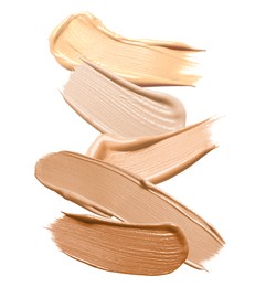 Image of Foundation of various shades for different skin tones isolated on white, top view. Set of samples