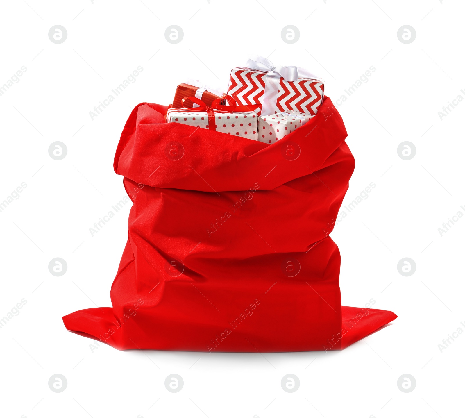 Photo of Santa Claus red bag full of presents on white background