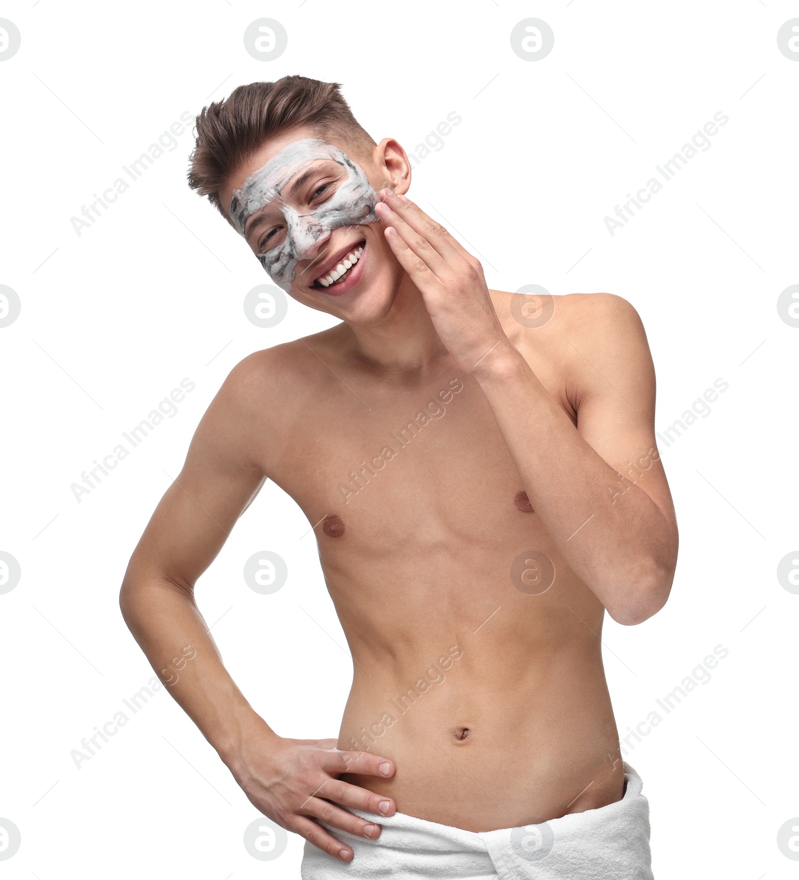 Photo of Handsome man with clay mask on his face against white background