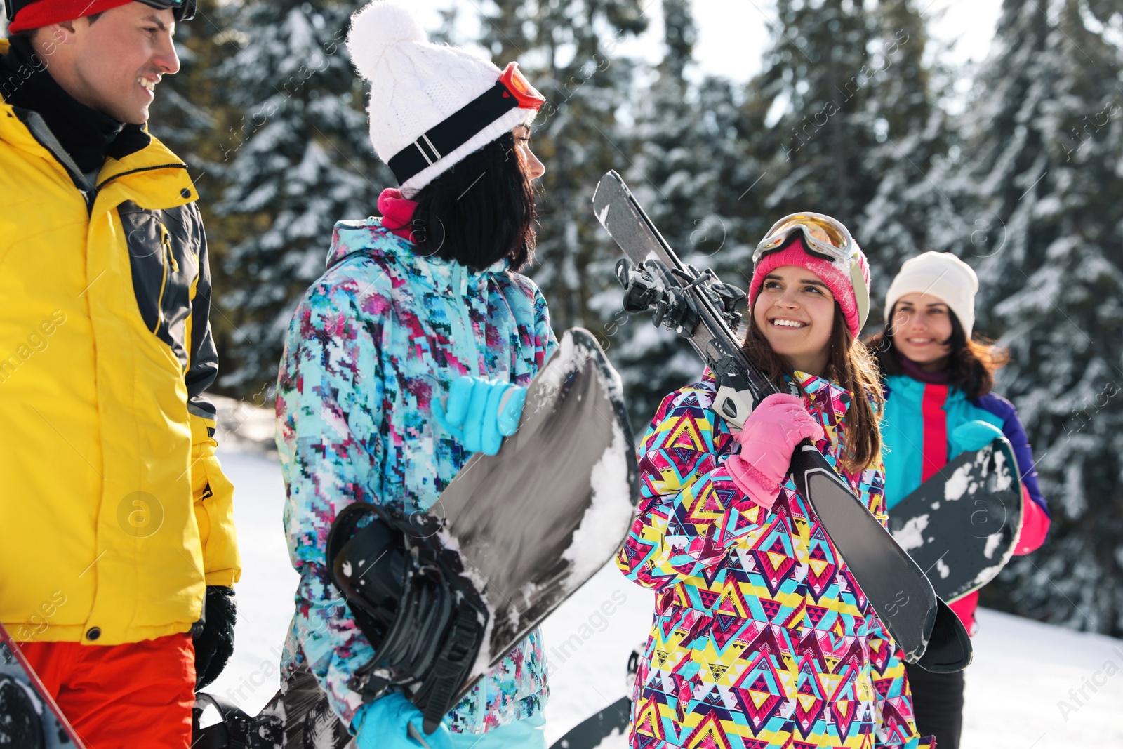 Photo of Group of friends with equipment in snowy mountains. Winter vacation