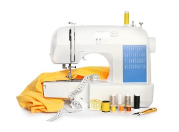 Photo of Modern sewing machine with yellow cloth and craft accessories isolated on white