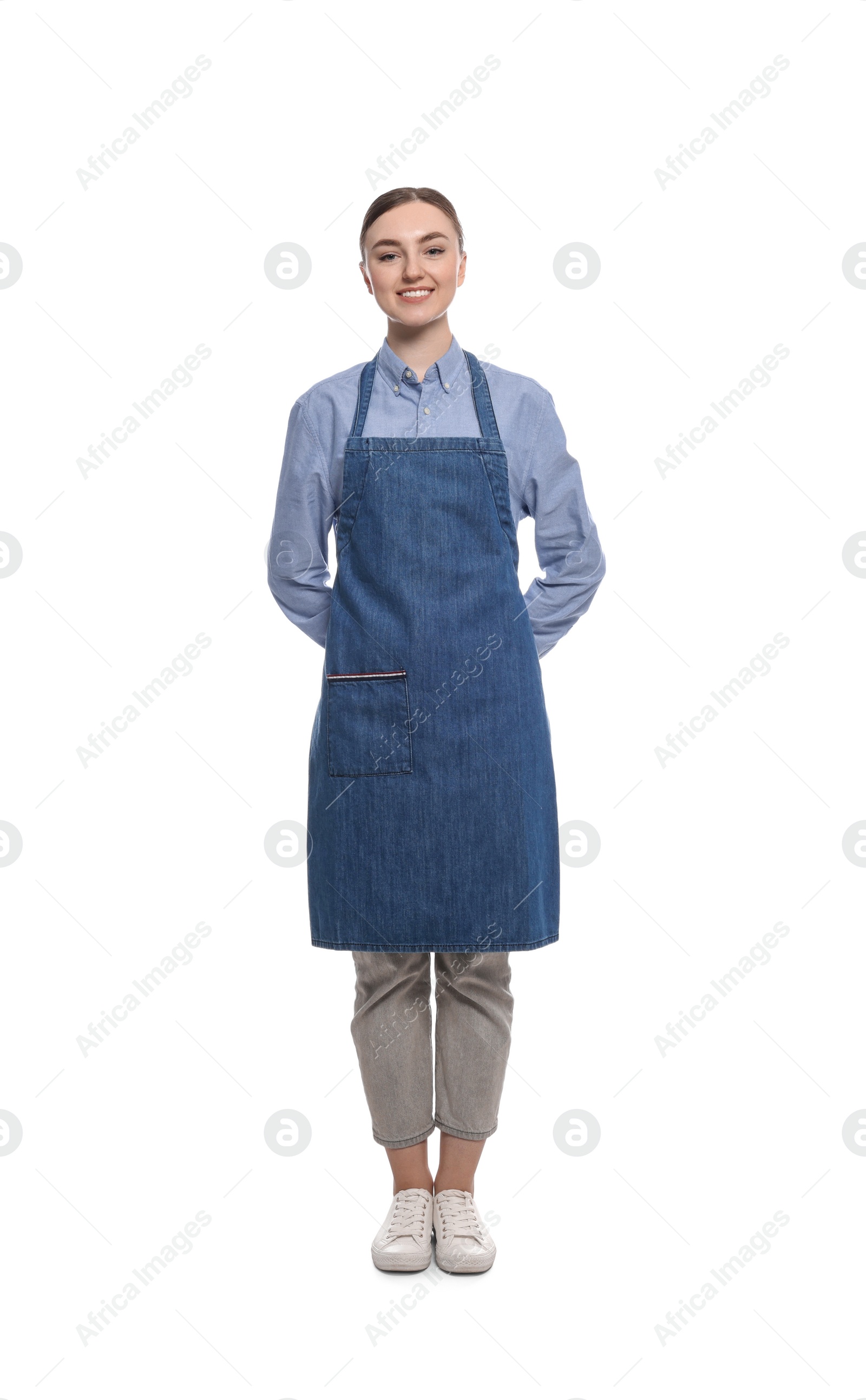 Photo of Beautiful young woman in clean denim apron on white background