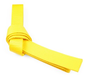 Photo of Yellow karate belt isolated on white. Martial arts uniform