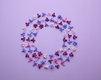 Photo of Frame made of blooming spring hyacinth flowers on color background, top view. Space for text