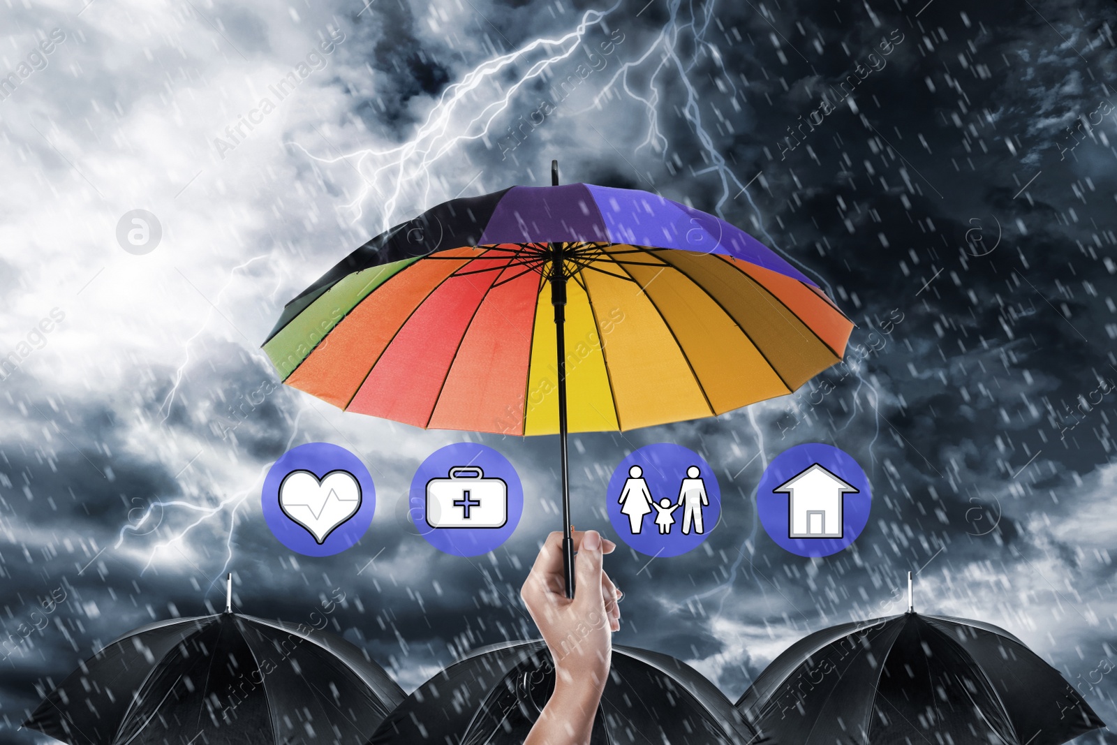 Image of Insurance agent covering illustrations with rainbow umbrella during storm