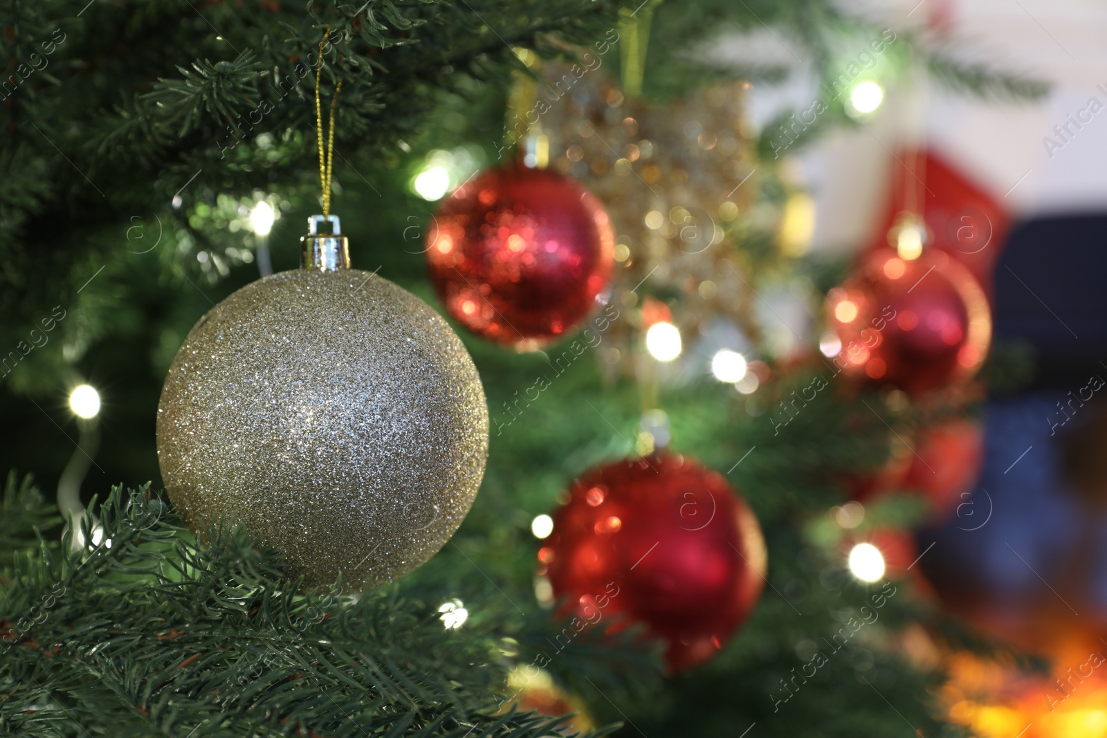 Photo of Beautifully decorated Christmas tree with bauble, closeup. Space for text