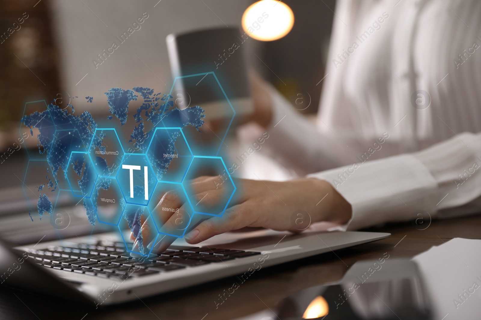 Image of Woman working with laptop at table indoors, closeup. Modern technology concept