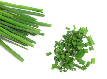 Photo of Fresh green spring onions on white background, top view