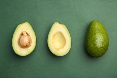 Photo of Flat lay composition with ripe avocados on color background