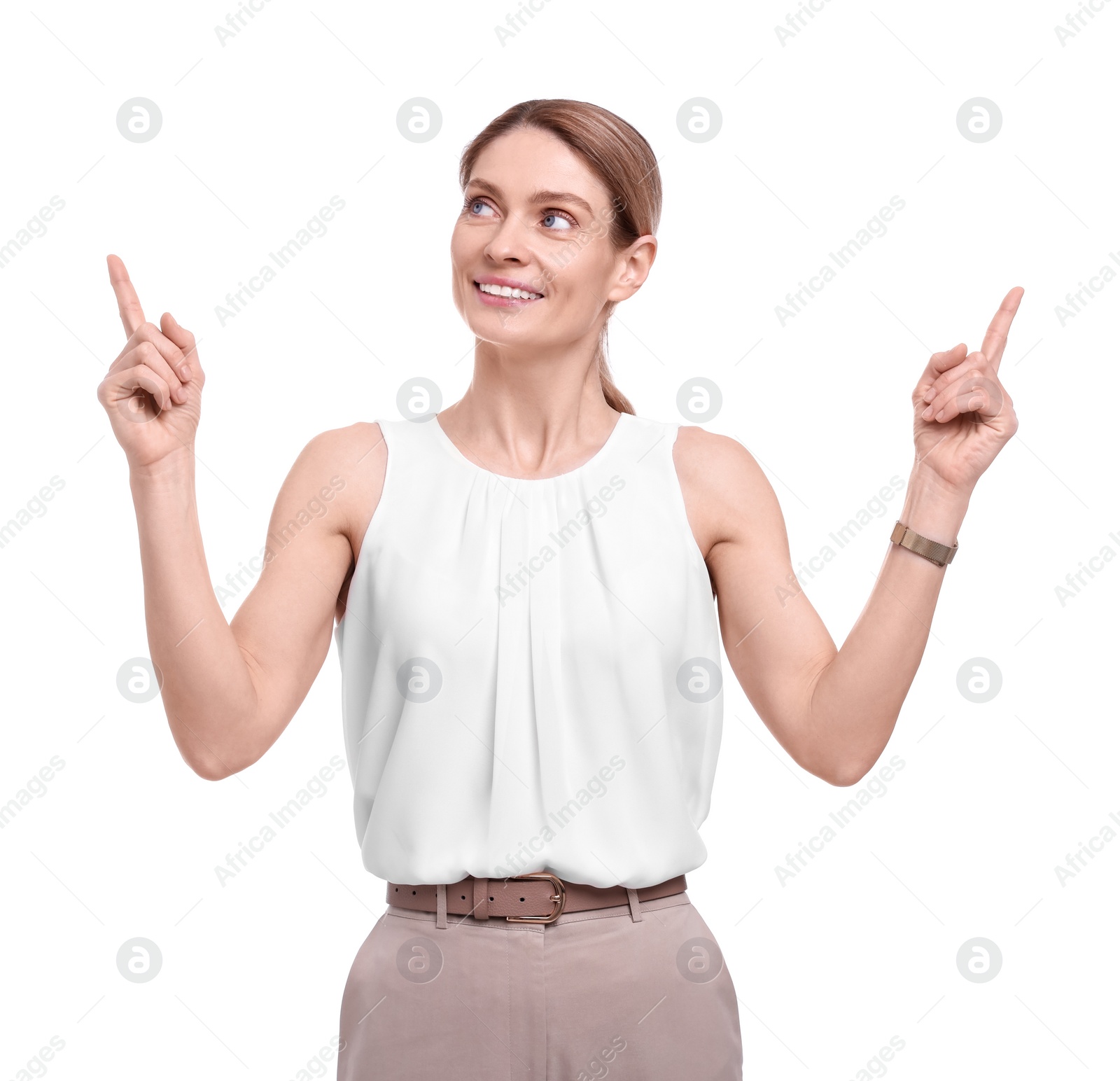 Photo of Beautiful happy businesswoman pointing at something on white background