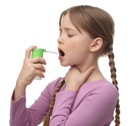 Photo of Little girl using throat spray on white background