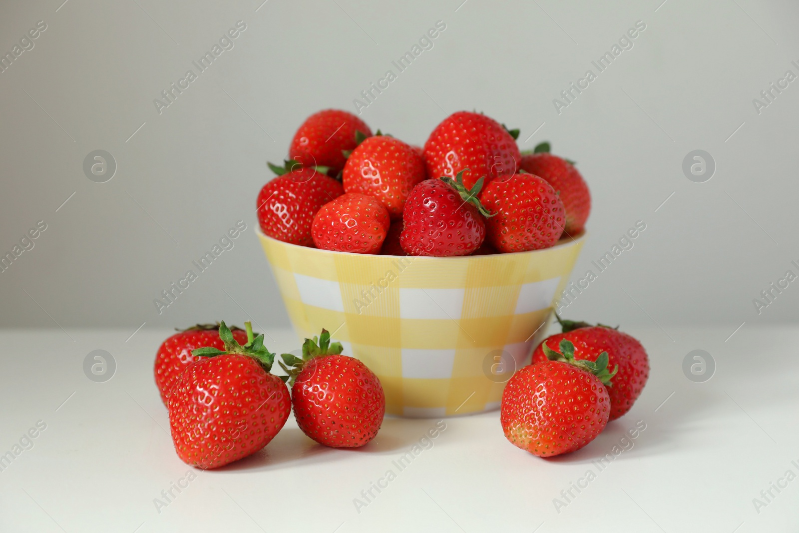 Photo of Fresh ripe juicy strawberries on white table