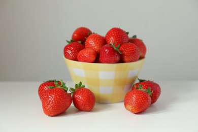 Photo of Fresh ripe juicy strawberries on white table