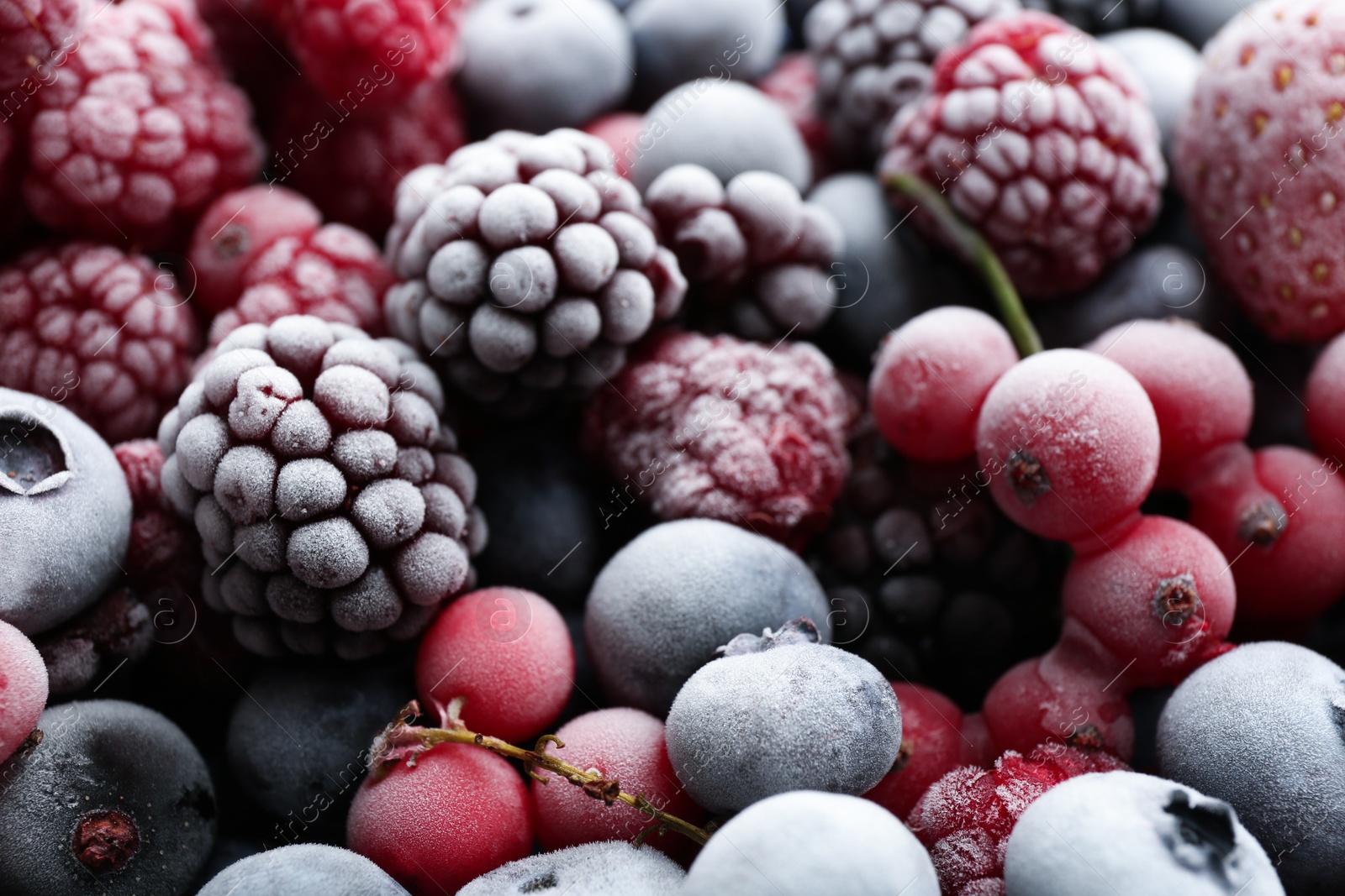 Photo of Mix of different frozen berries as background, closeup view