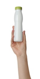 Woman holding plastic bottle on white background, closeup