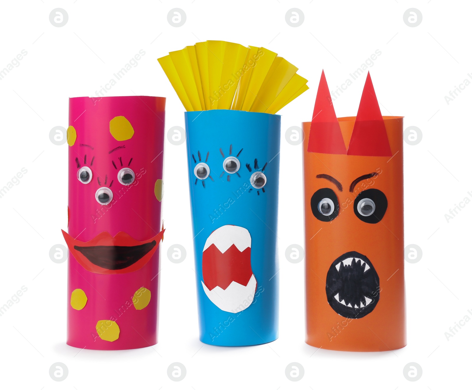 Photo of Funny monsters on white background. Halloween decoration