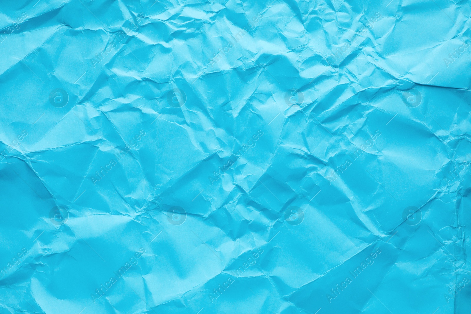 Photo of Sheet of color crumpled paper as background. Space for design