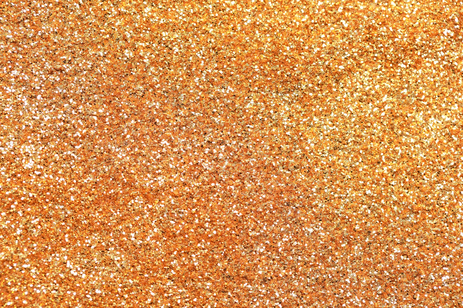 Photo of Beautiful golden shiny glitter as background, top view