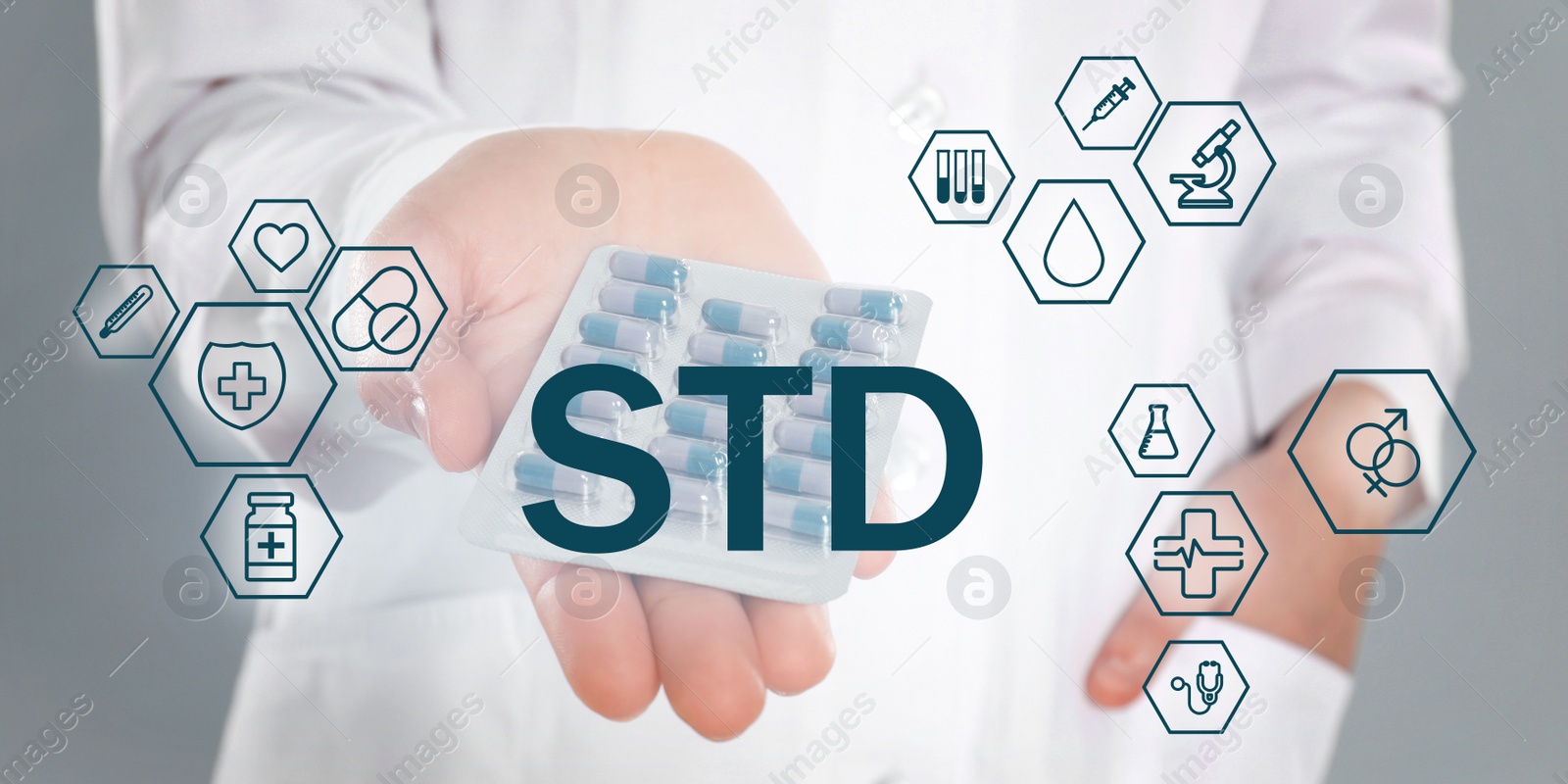 Image of STD prevention. Closeup view of doctor with pills, abbreviation and different icons on light background, banner design