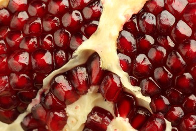 Ripe juicy pomegranate grains as background, closeup