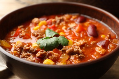 Bowl with tasty chili con carne, closeup view