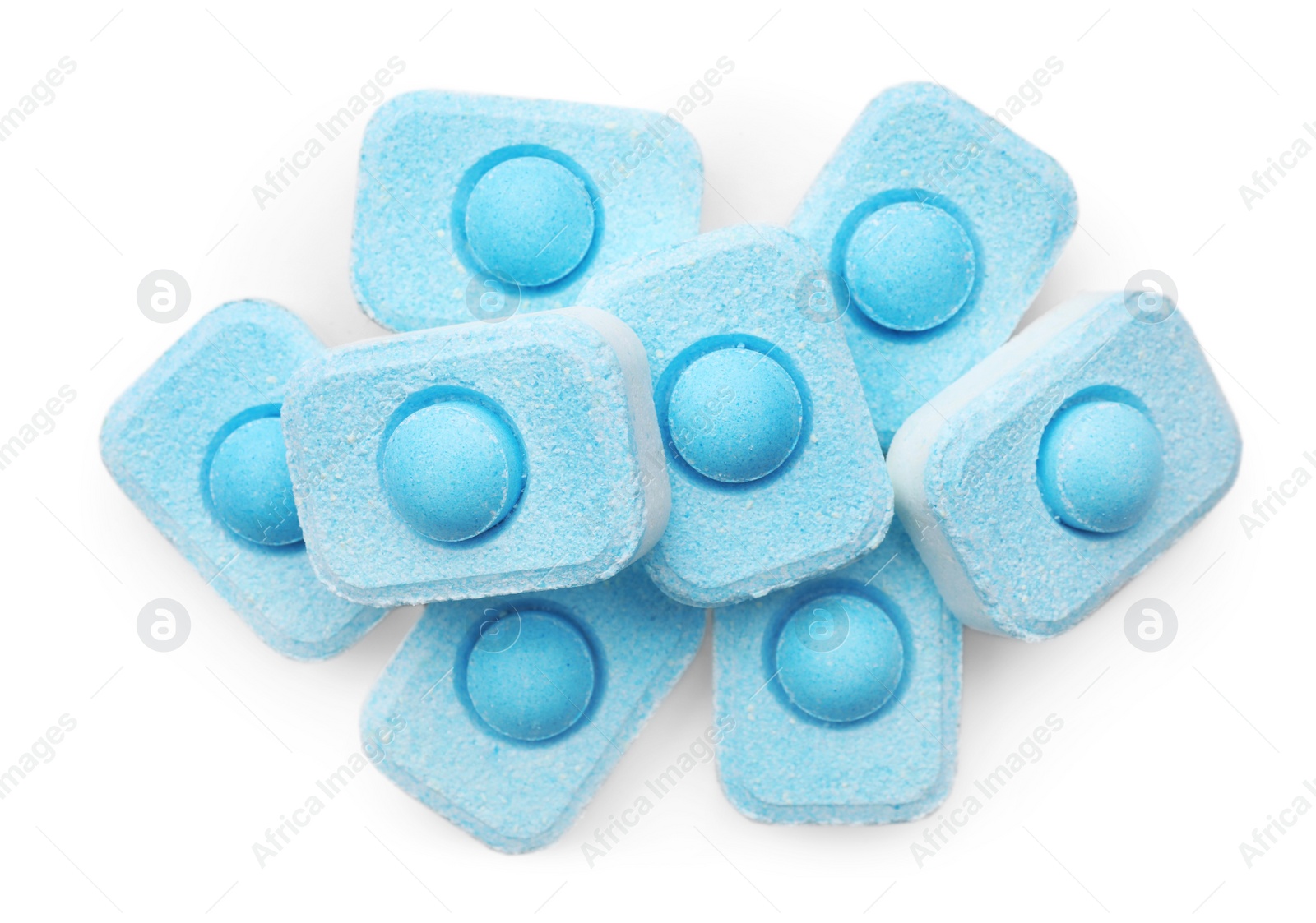 Photo of Pile of water softener tablets on white background, top view