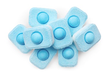 Pile of water softener tablets on white background, top view