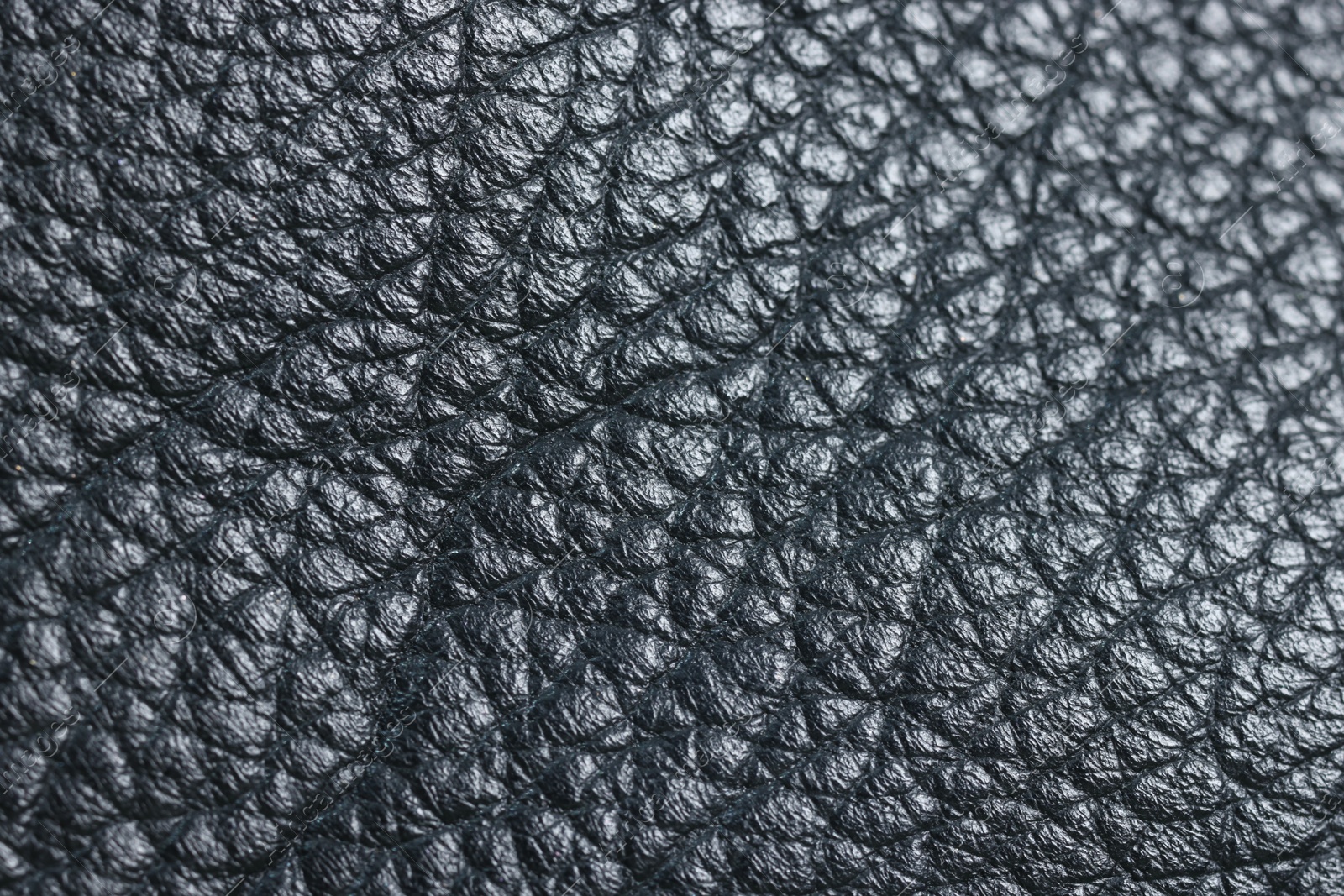 Photo of Black natural leather as background, top view