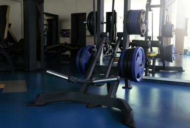 Photo of Interior of modern gym with new equipment