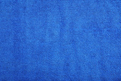 Photo of Blue microfiber cloth as background, top view