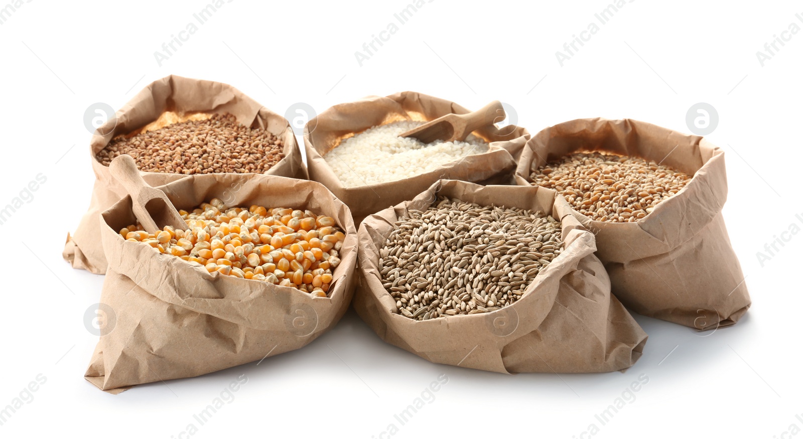 Photo of Paper bags with different types of grains and cereals on white background