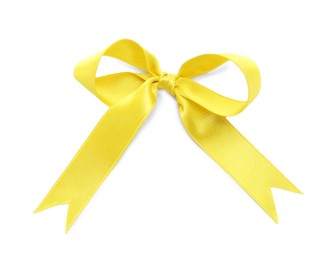 Photo of Beautiful yellow ribbon tied in bow isolated on white, top view