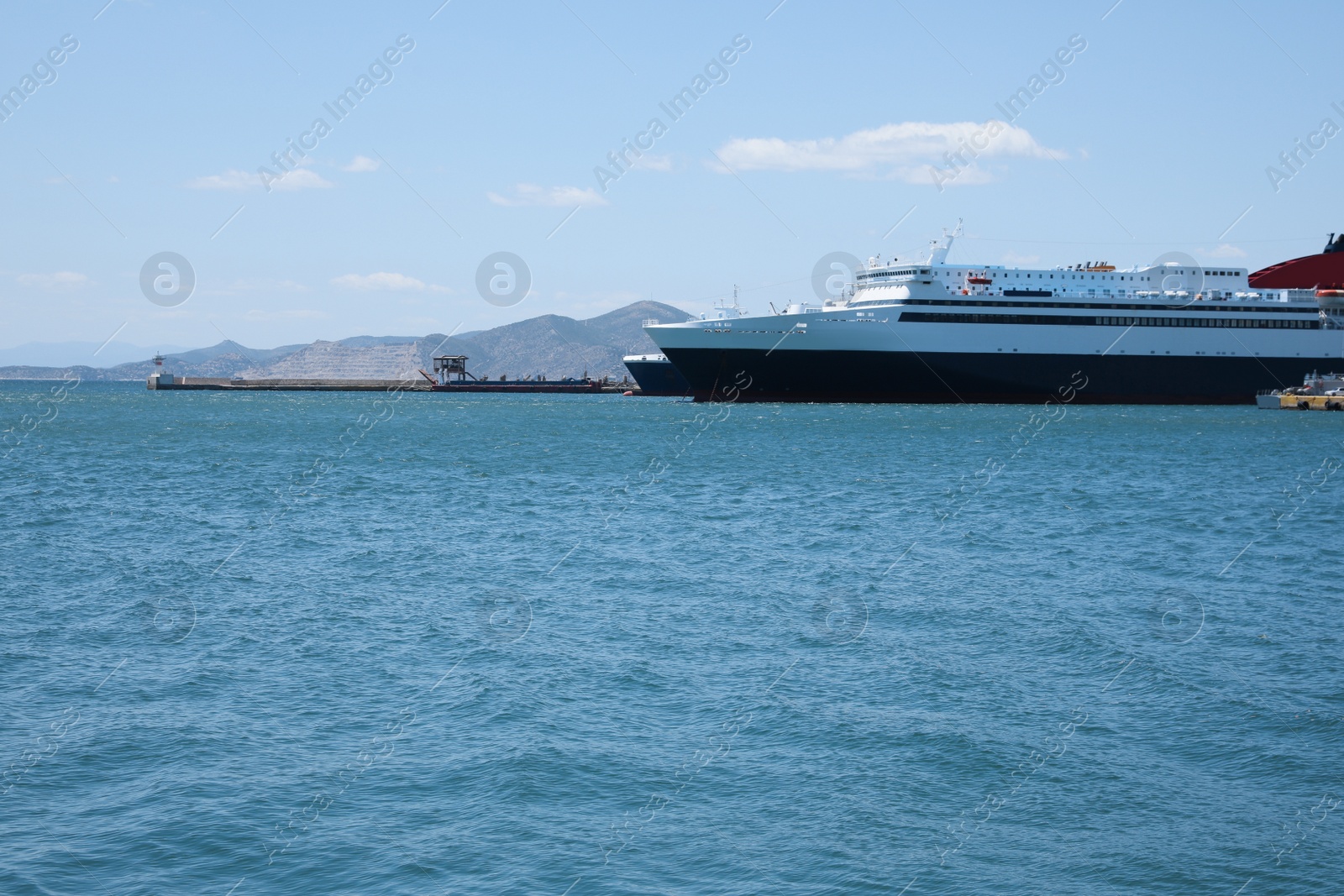 Photo of Modern ferry in sea port on sunny day