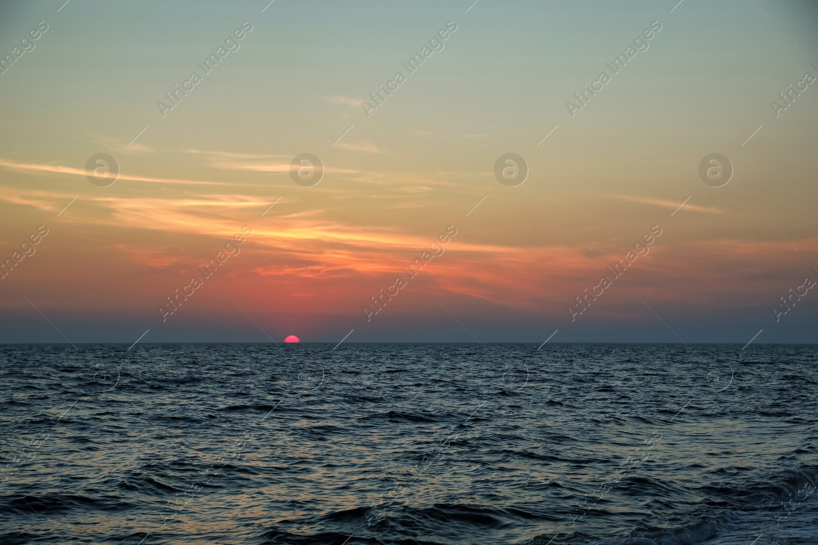 Photo of Beautiful sky with sun over sea at sunset