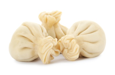 Boiled dumplings with tasty filling on white background