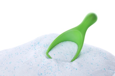 Photo of Measuring scoop with laundry powder on white background