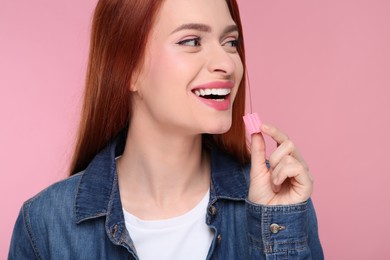 Photo of Beautiful woman with bubble gum on pink background