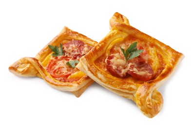 Photo of Fresh delicious puff pastry with cheese, tomatoes and parsley on white background, closeup