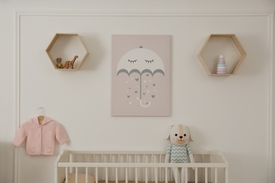 Photo of Modern baby room interior with crib and toys