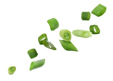 Image of Cut green onion falling on white background